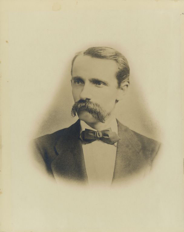 Black and white photograph of man with a mustache