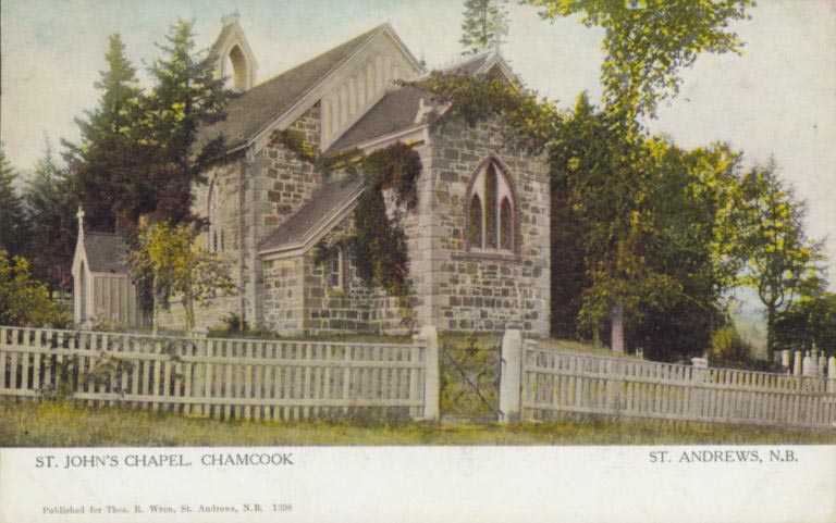 Colour postcard of stone church with ivy and white picket fence