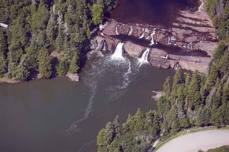 Colour aerial photograph of waterfalls, rocky ledges and trees