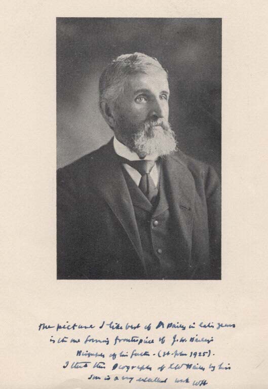 Black and white photograph of man in a suit with full beard