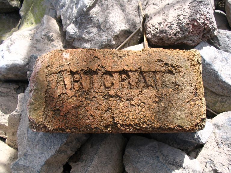 Colour photograph of old brick stamped ARTCRA