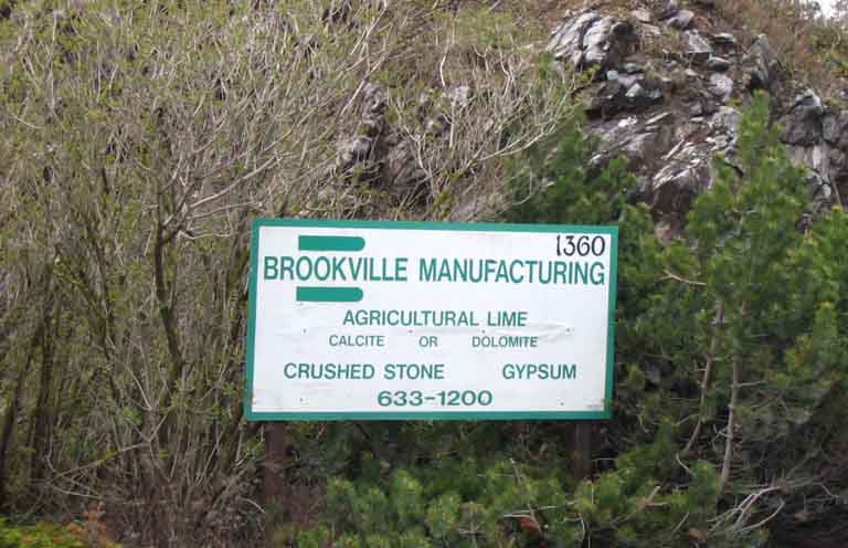 Colour photograph of white sign with green lettering
