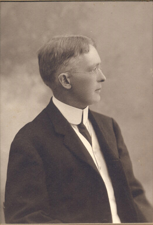 Black and white photograph of man in a suit