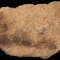Colour image of pink rock with small white and black spots