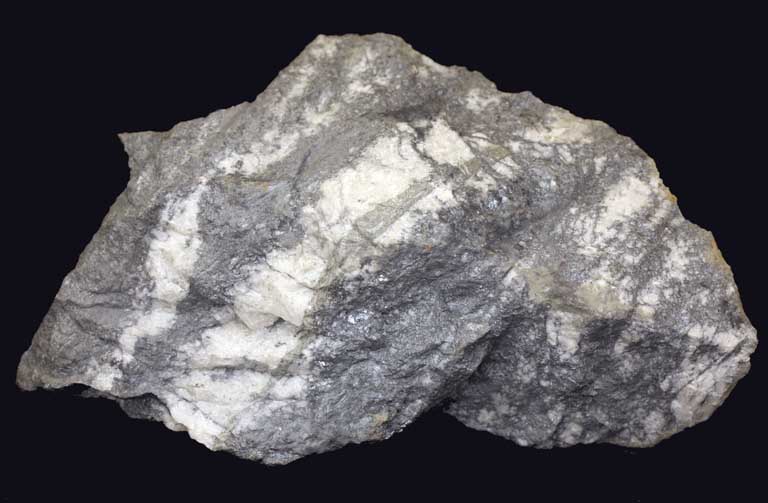 Colour image of gray rock with diagonal white stripes