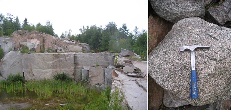Colour photograph of granite quarry with hammer to indicate scale of boulders