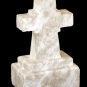 Colour image of white rock streaked with brown in the shape of a memorial cross