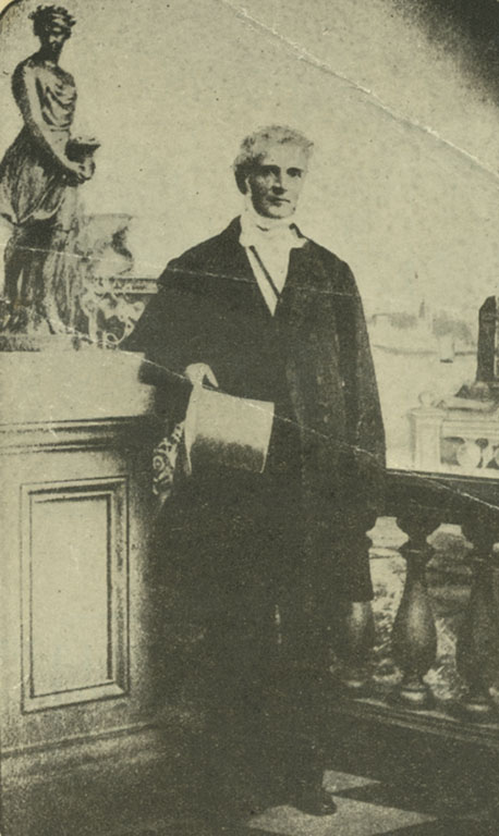 Black and white photograph of a man with a tophat