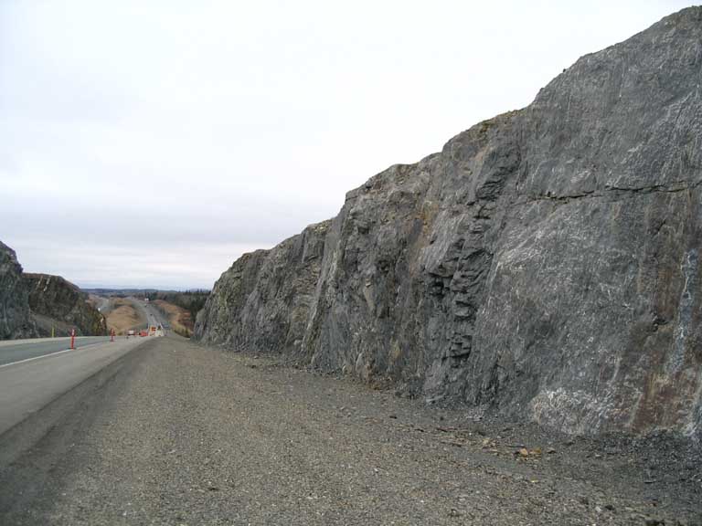 Colour photograph of highway and rock face