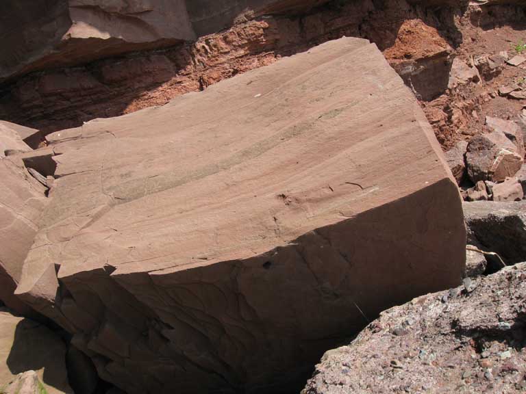 Colour photograph of a red sandstone rock