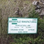 Colour photograph of white sign with green lettering