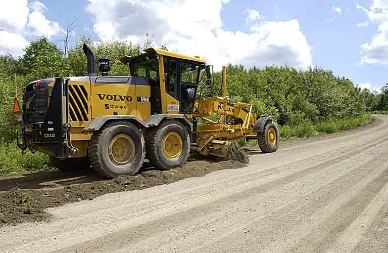 Grader rebuilding a gravel road