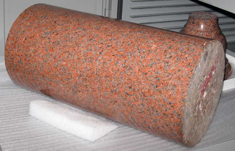 Colour image of red rock with black, white and gray spots